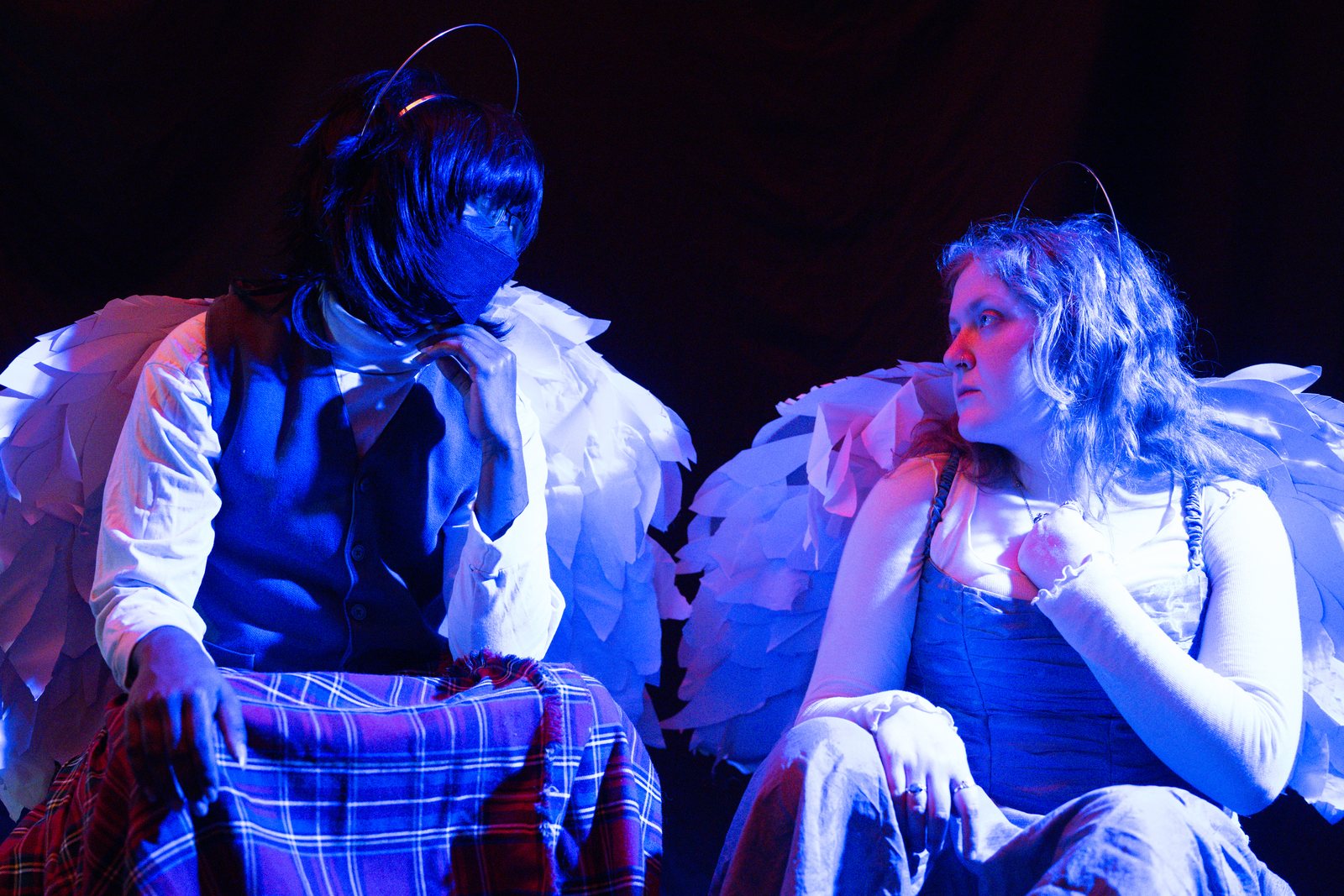 Lost Angels, two angels facing each other in blue and red light