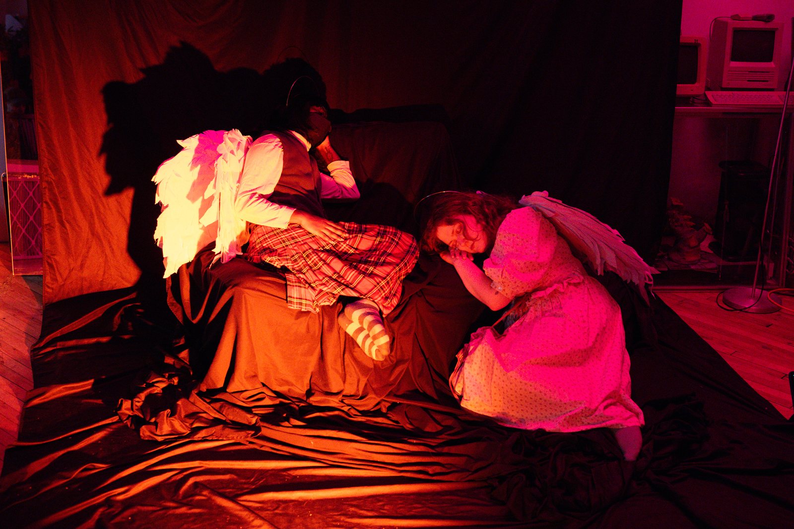 Lost Angels, angels reclining in warm red light