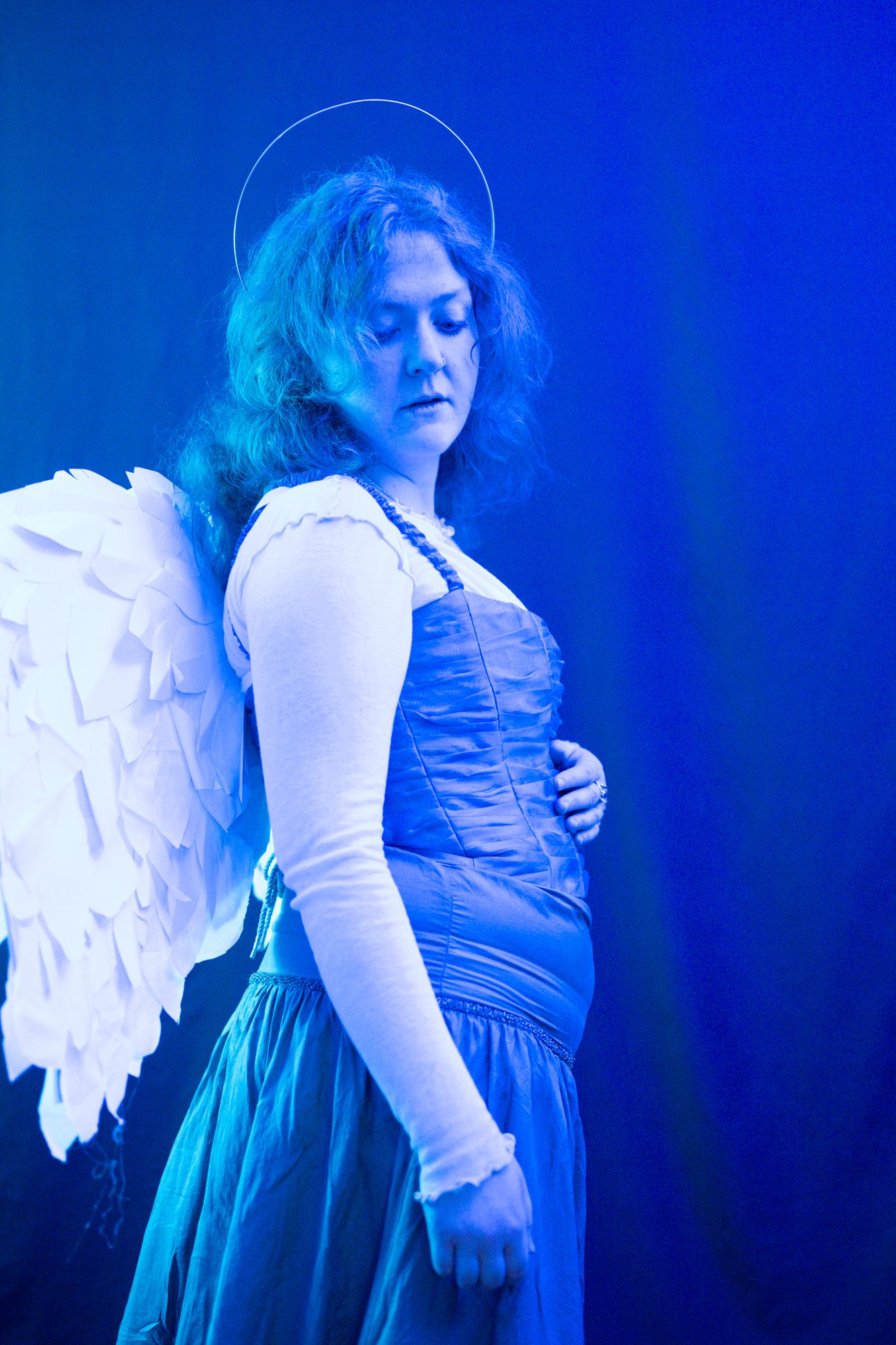 Lost Angels — winged model in blue light