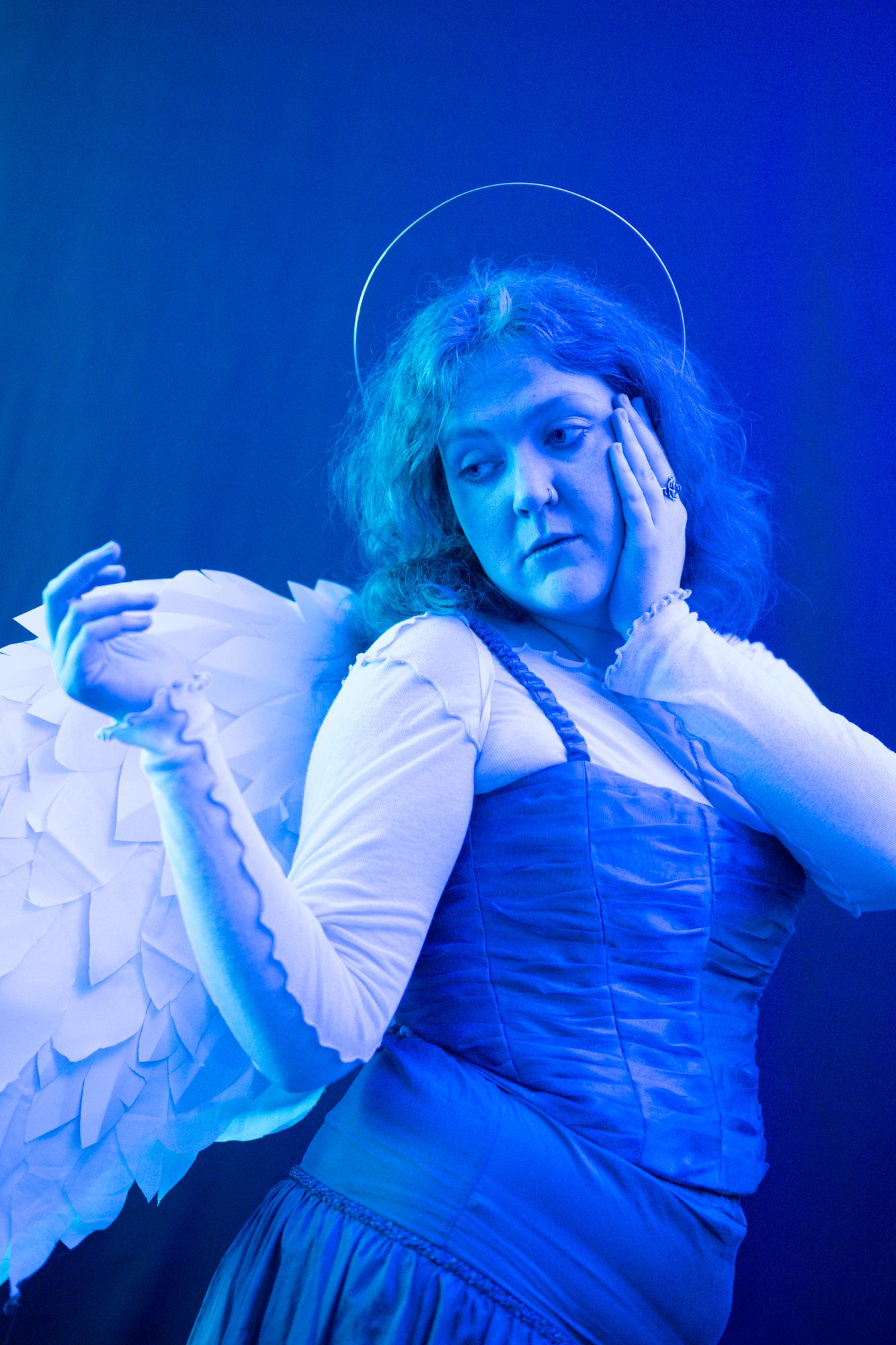Lost Angels, winged model in blue light