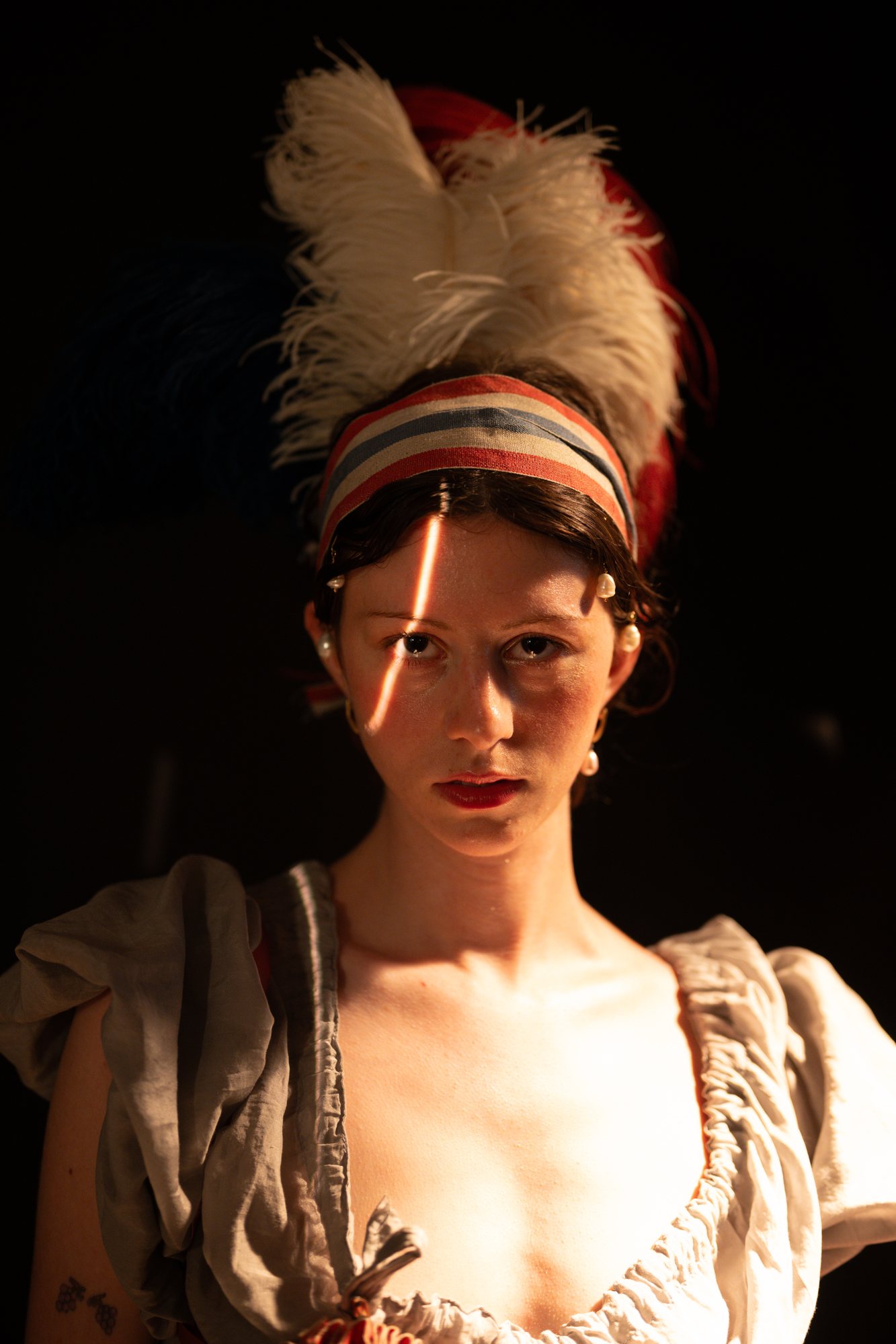 French Revolution photoshoot, portrait of the model in candlelight