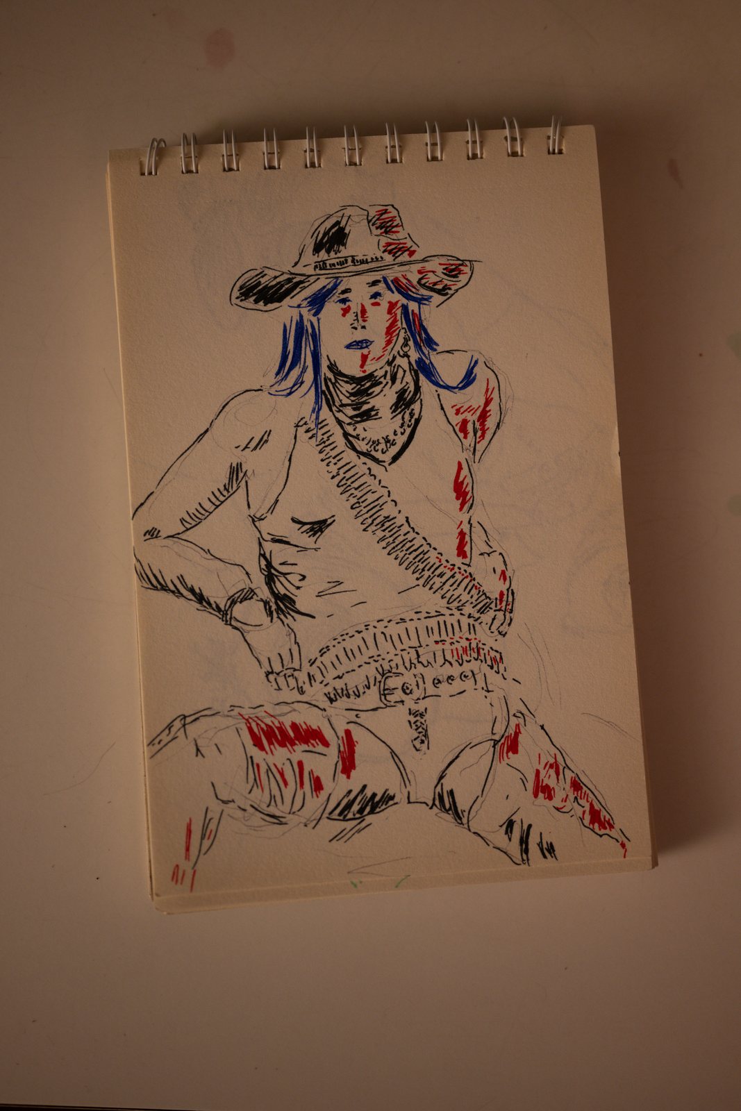 Gothic Country, a pen drawing of the seated model in red and blue ink
